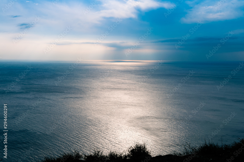 Seascape view with clouds and sky and water ripples