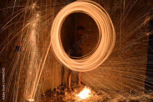 Ring of fire with long exposure at night. Light background. Click at in dark room