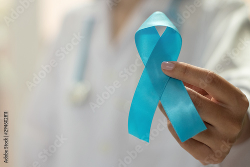 November men health concept.Light blue ribbon awareness for campaign  Prostate cancer and lymphedema disease. photo