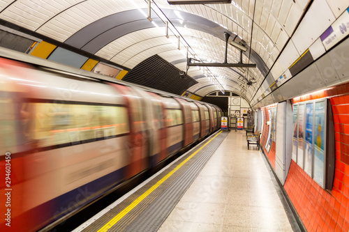 Underground Tube Station with Moving train motion blurred in London, UK photo