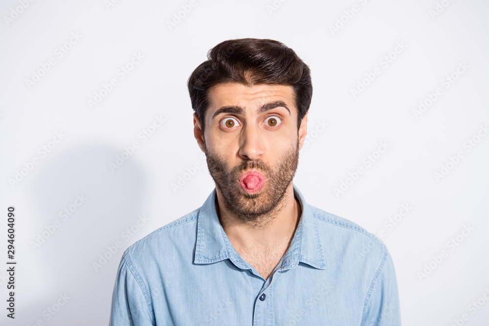 Photo of multiethnic impolite guy sticking tongue out of mouth teasing girlfriend bad mood wear casual denim shirt isolated white color background Photo of multiethnic impolite guy sticking tongue out of mouth teasing girlfriend bad mood wear casual denim shirt isolated white color background