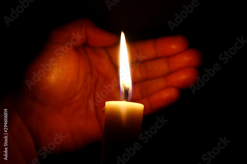 Hand and candle