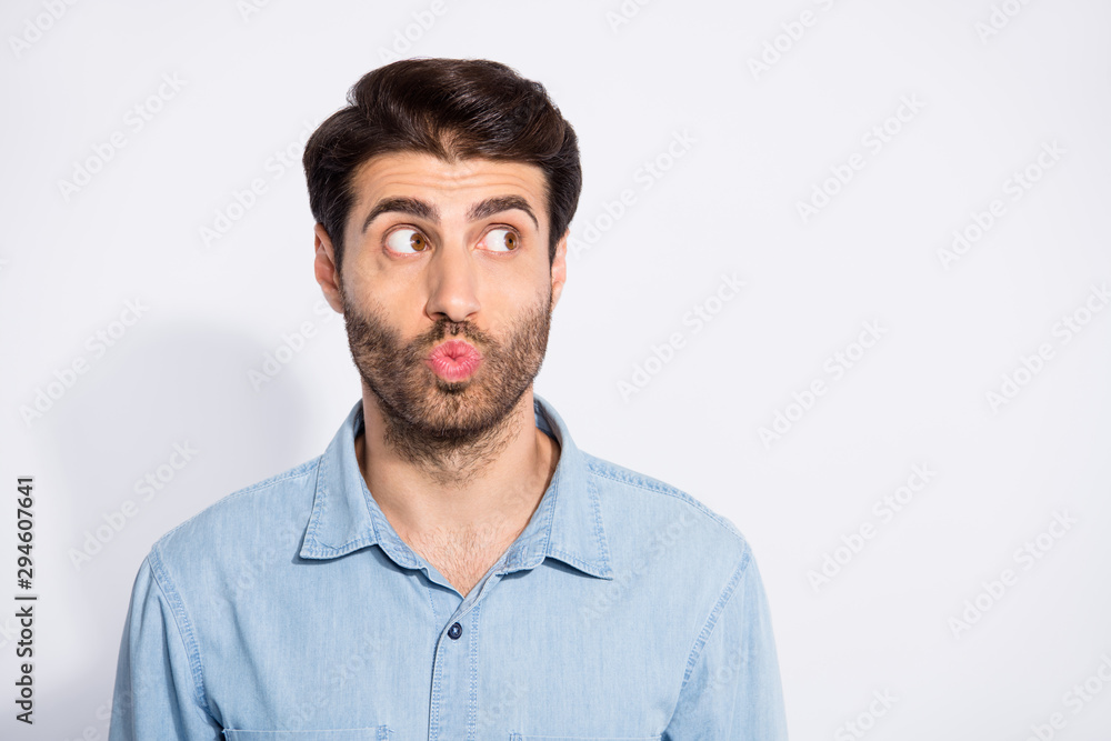 Photo of amazing arab macho guy looking empty space sending air kiss wondered if it was received wear casual denim shirt isolated white color background Photo of amazing arab macho guy looking empty space sending air kiss wondered if it was received wear casual denim shirt isolated white color background