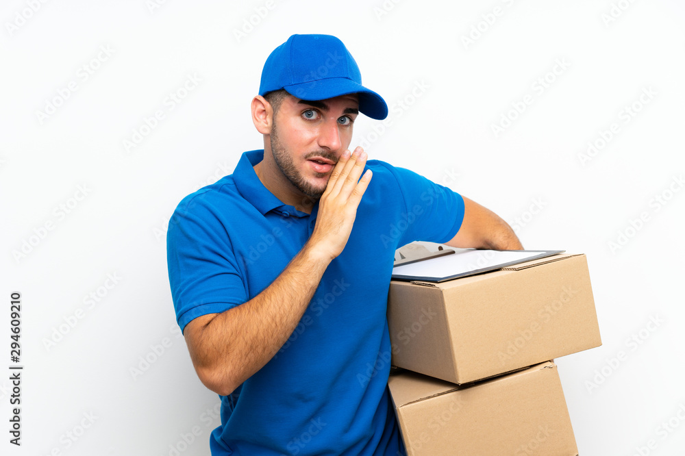 Delivery man over isolated white background whispering something Delivery man over isolated white background whispering something