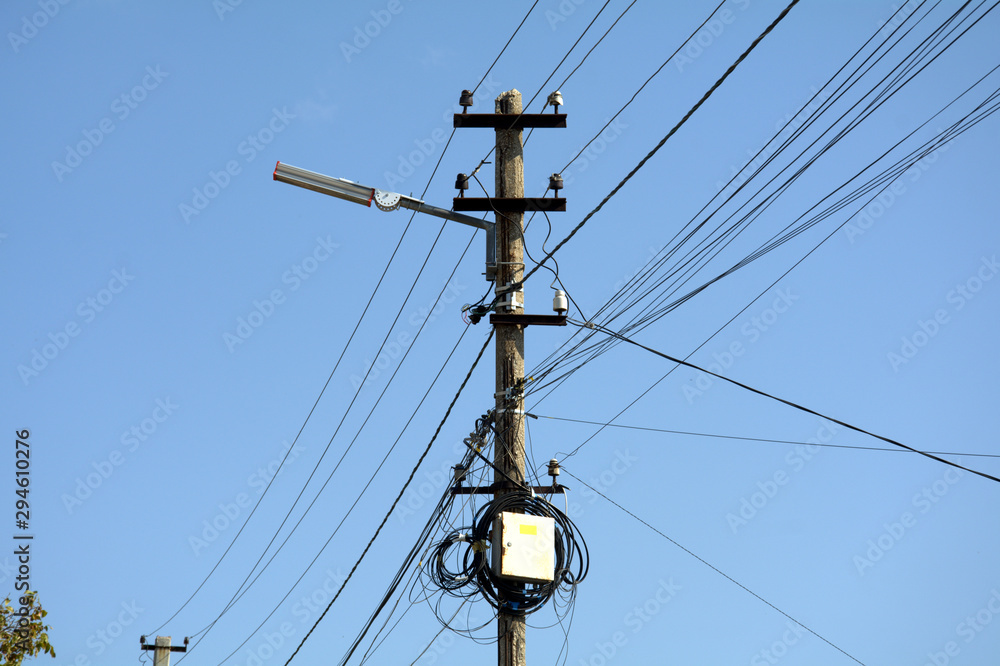 old wooden post with wires and internet junction boxes old wooden post with wires and internet junction boxes