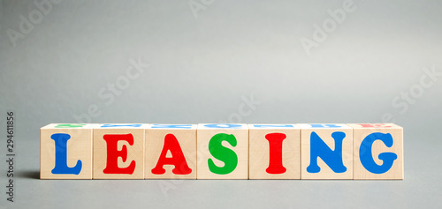 Wooden blocks with the word Leasing. Rental with repurchase rights. Acquisition of expensive goods - transport, real estate. Business and finance concept