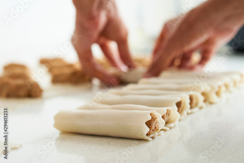 man preparing meat stuffed cannelloni