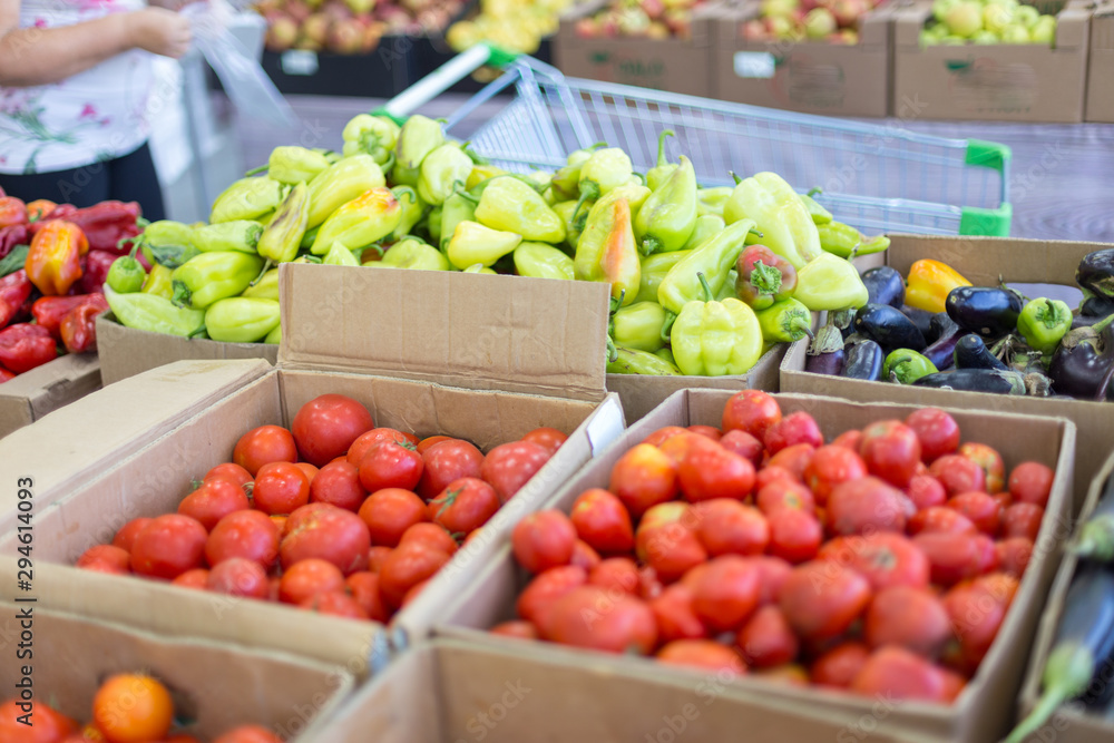 supermarket sells fresh tomatoes, eggplant and bell peppers