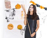 Front view beautiful woman with halloween broom