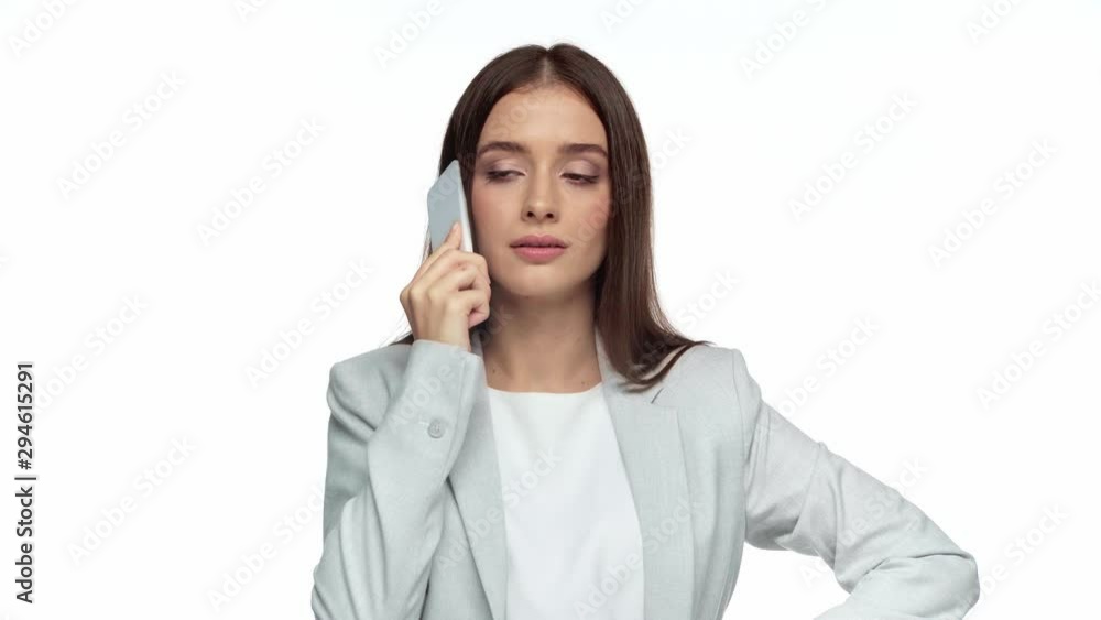 displeased businesswoman talking on smartphone isolated on white displeased businesswoman talking on smartphone isolated on white