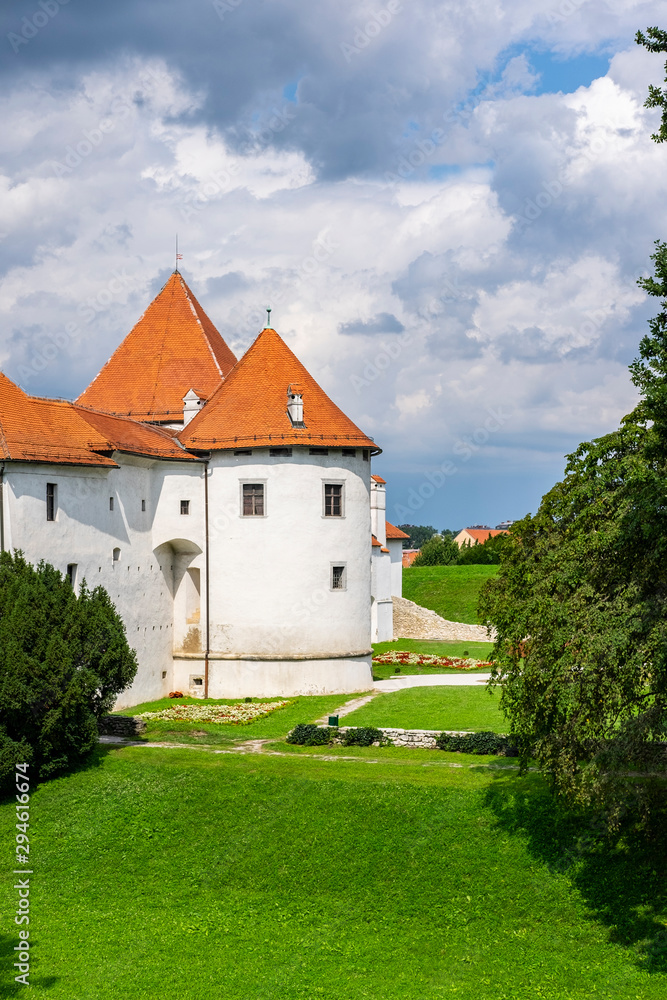 Historical fortress of old castle in Varazdin city, Croatia, green trees and sunny summer day