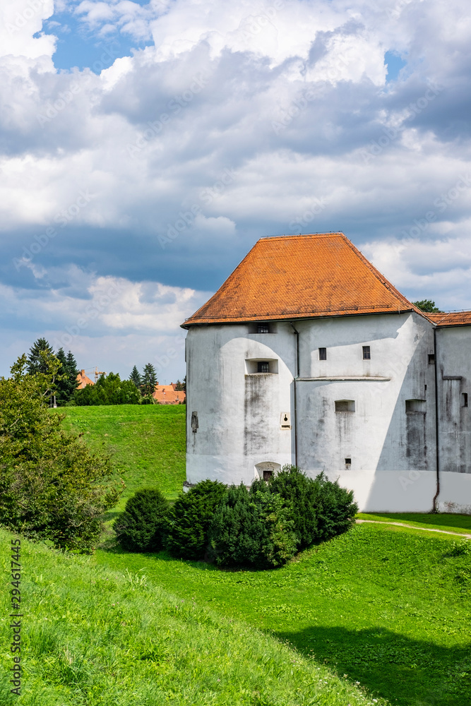 Historical fortress of old castle in Varazdin city, Croatia, green trees and sunny summer day