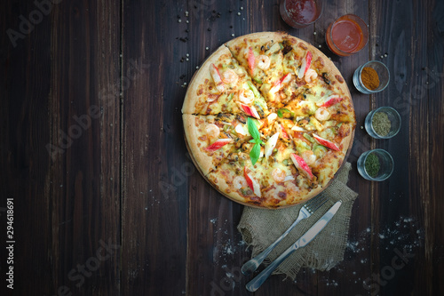 pizza on the wood table. Top view with copyspace for your text