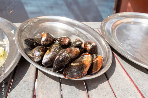 a bowl of freshly prepared mussels - preparing a tradional spanish paella