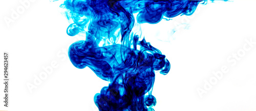 The blue color paint splash drips into clear water.