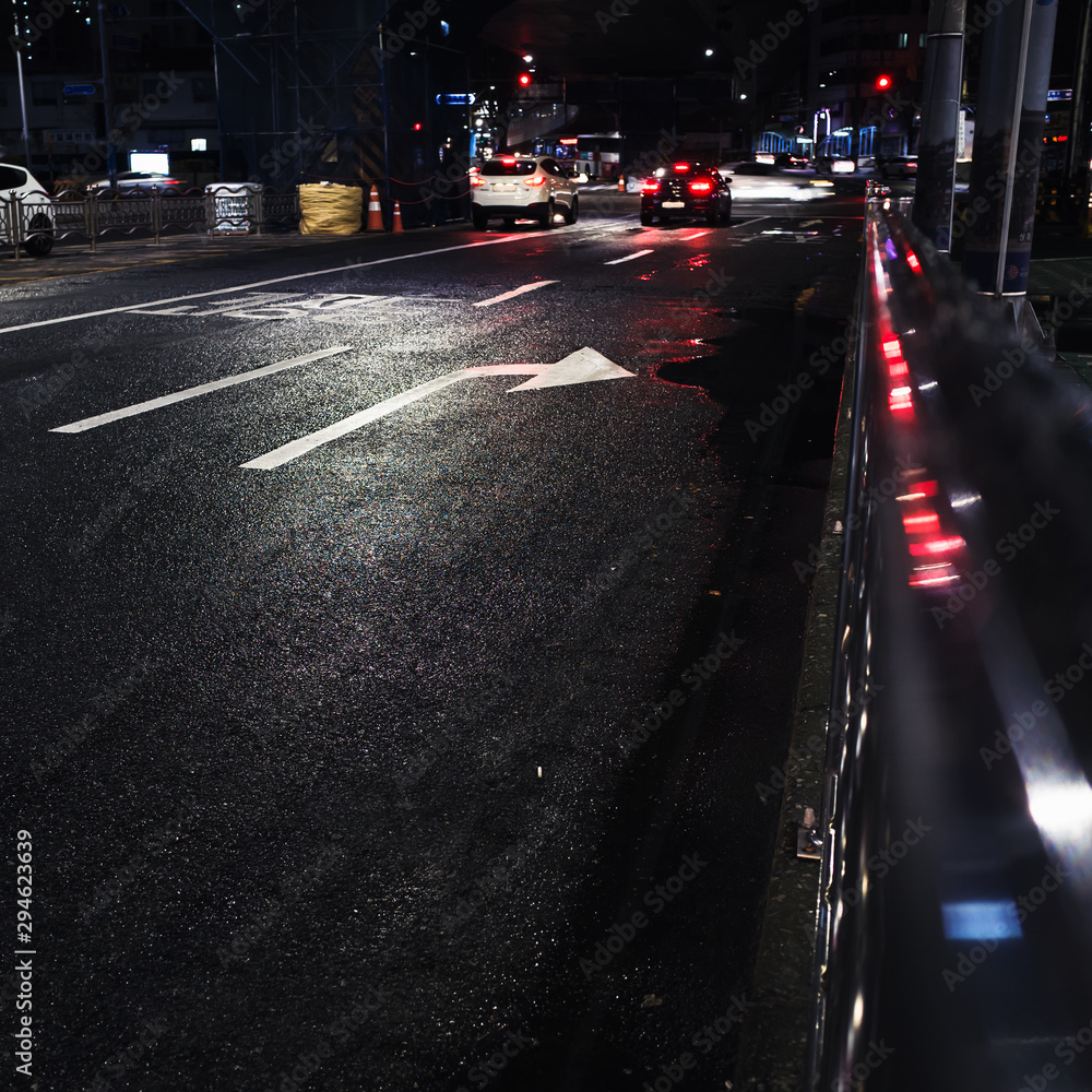 Road marking arrows and red lights Road marking arrows and red lights