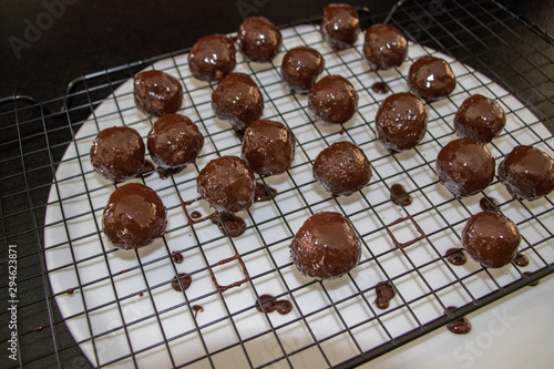 a few chocolate balls above plate close up