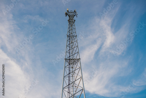 Telecommunication pole against the beautiful sky. © weerawat