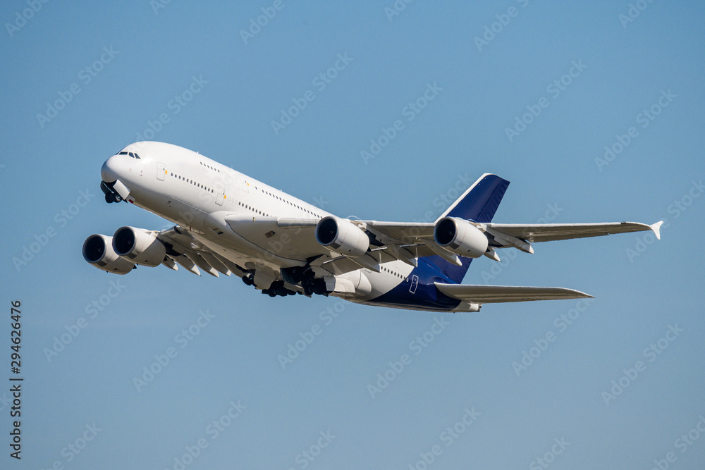 Blank unlabeled Airbus A380 4-engine jet airliner starting at the frankfurt airport takeoffairplane concept - obrazy, fototapety, plakaty 