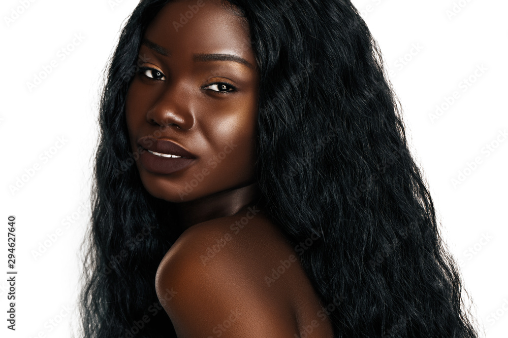 Young African women portrait. Beautiful fashion model with wavy hair and  natural make up isolated on white Stock Photo | Adobe Stock