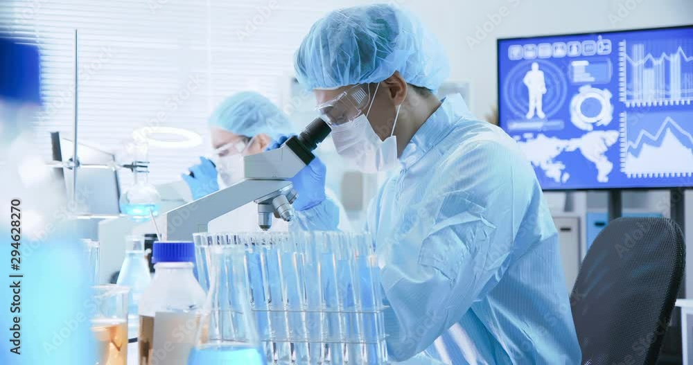 asian scientist use microscope asian scientist use microscope