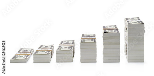 Canvas Print Increasing piles of dollar bills isolated on white background