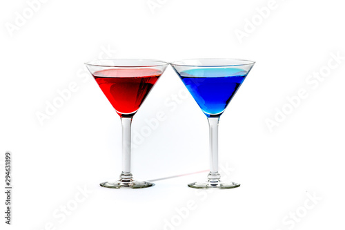 martini glasses with colorful cocktails isolated on white
