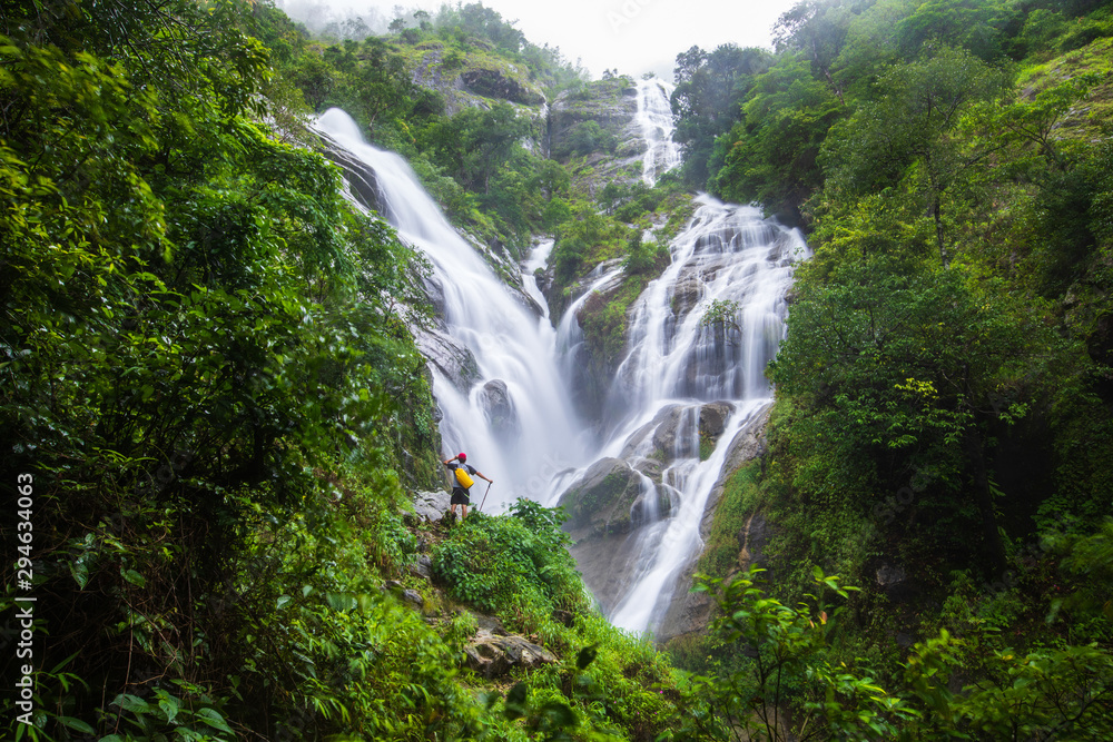 The man touring on Pi-tu-gro waterfall, Beautiful waterfall in Tak  province, ThaiLand.
