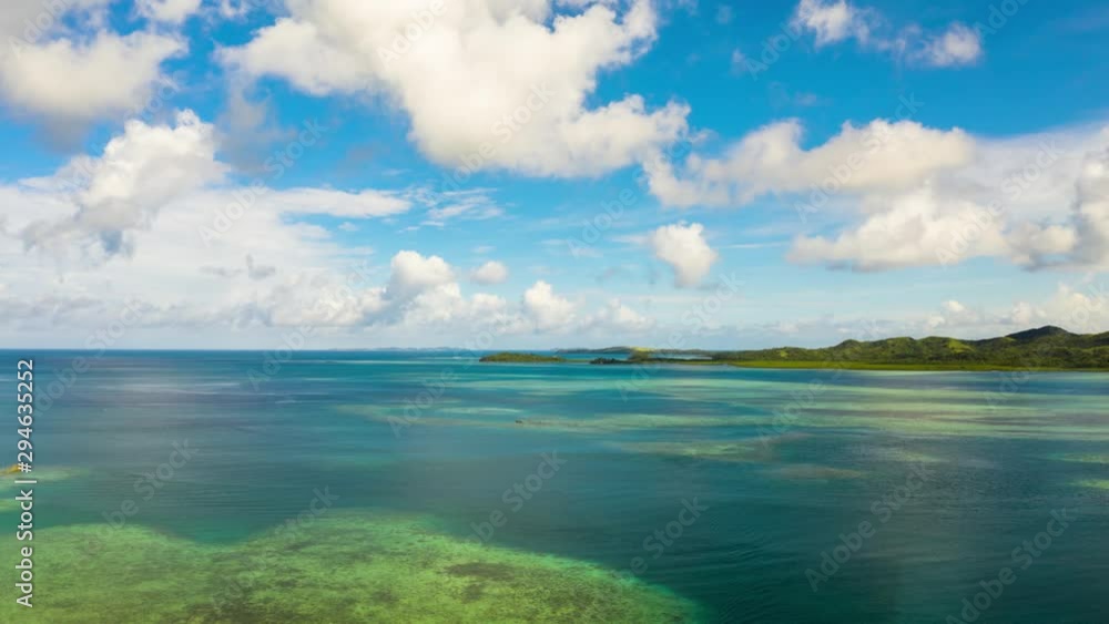 Seascape time lapse: Tropical Islands with beaches and azure coral reef water from above. Bucas grande, Philippines. Summer and travel vacation concept. Seascape time lapse: Tropical Islands with beaches and azure coral reef water from above. Bucas grande, Philippines. Summer and travel vacation concept.