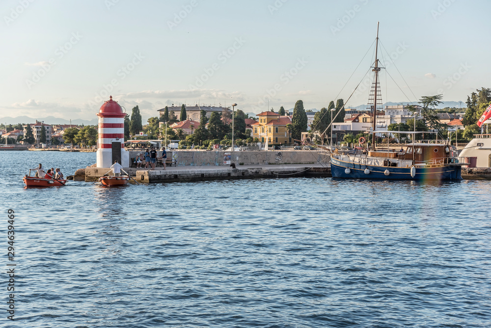 A small lighthouse and pier in the city of Zadar, Croatia.