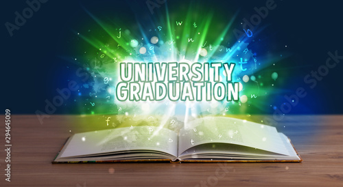 UNIVERSITY GRADUATION inscription coming out from an open book, educational concept