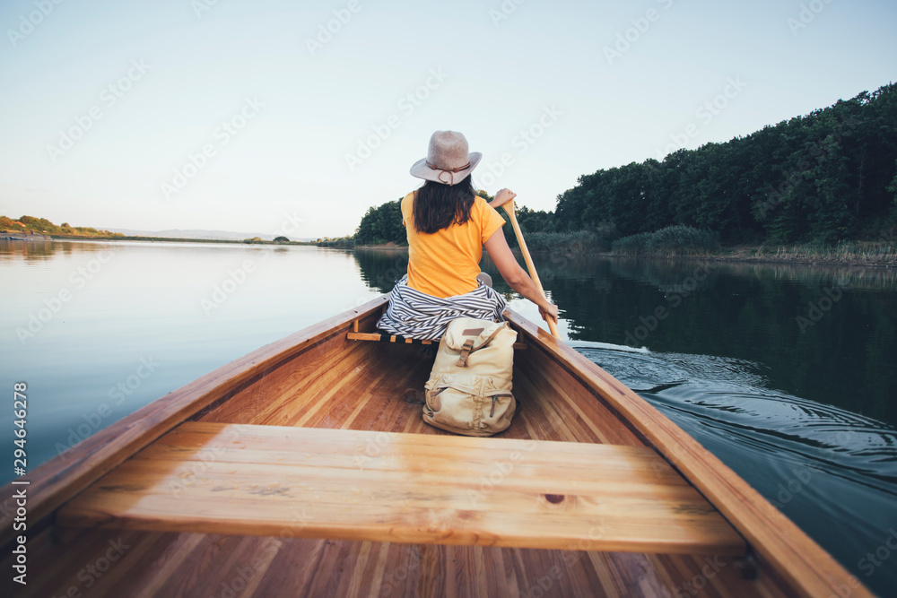 Woman paddling canoe
