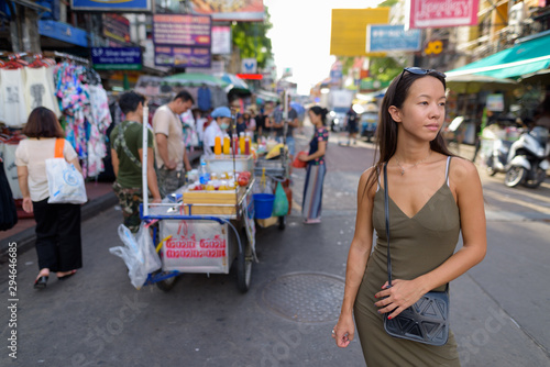 Tourist woman exploring the city of Bangkok at Khao San Road photo