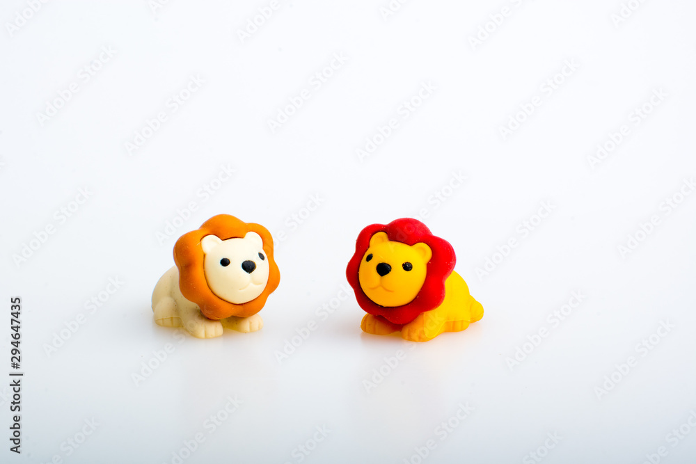 Two lion rubber toys, cute animal shaped rubber doll isolated in white background. Two lion rubber toys, cute animal shaped rubber doll isolated in white background.