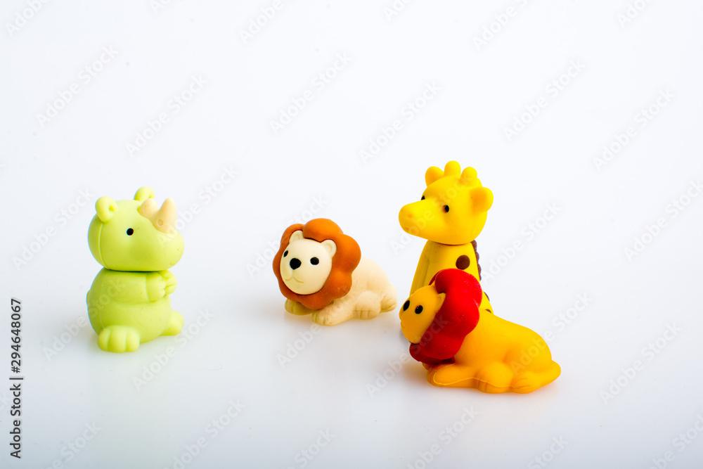 Giraffe, lion, gorilla and rhino rubber toys, cute animal shaped rubber doll isolated in white background. Giraffe, lion, gorilla and rhino rubber toys, cute animal shaped rubber doll isolated in white background.