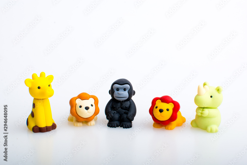 Giraffe, lion, gorilla and rhino rubber toys, cute animal shaped rubber doll isolated in white background. Giraffe, lion, gorilla and rhino rubber toys, cute animal shaped rubber doll isolated in white background.