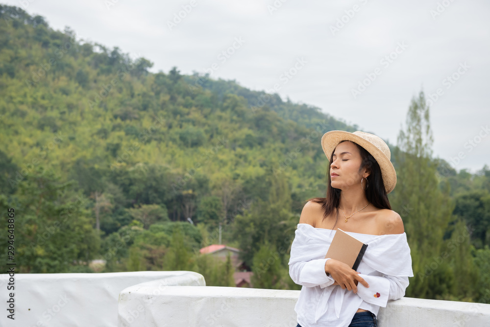 asia woman hand hold the book to read