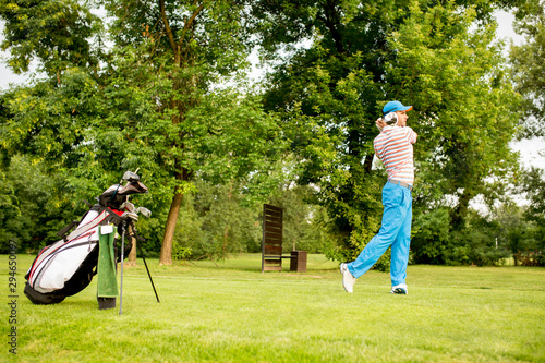 Young man playing golf
