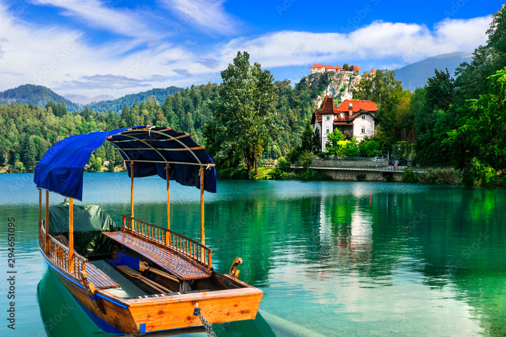 Beautiful romantic lake Bled in Slovenia. view with traditional wooden boat