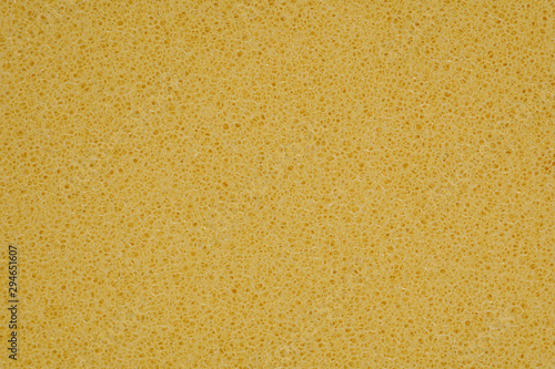 Valokuva yellow polyurethane foam rubber pieces background texture