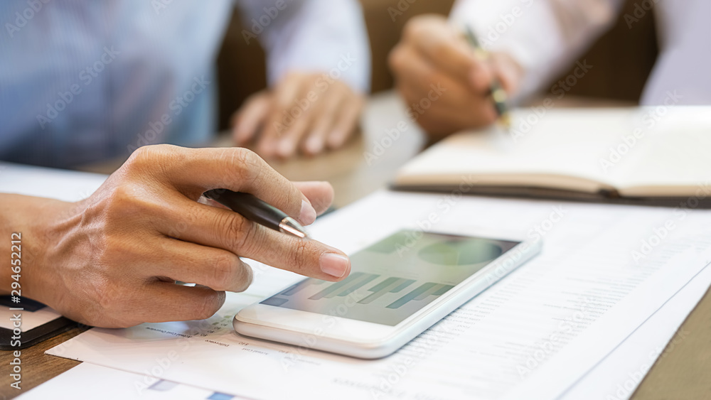 Business team brainstorming and discussing with financial data and report graph. Teamwork meeting working concept. Business team brainstorming and discussing with financial data and report graph. Teamwork meeting working concept.