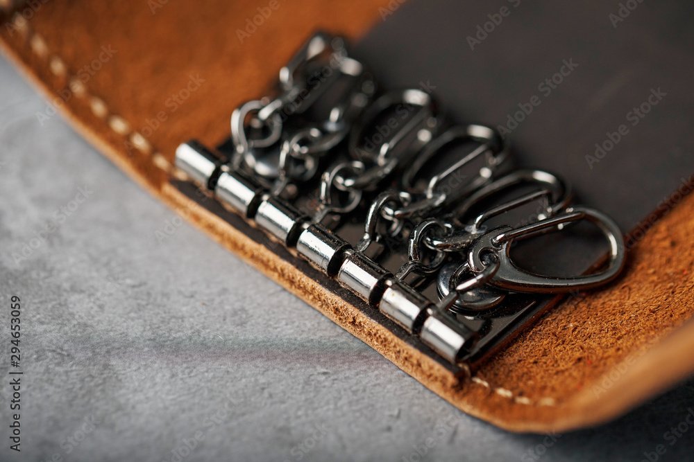 Wallet Keymaster made of brown Genuine leather, handmade on a dark background Wallet Keymaster made of brown Genuine leather, handmade on a dark background