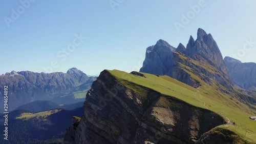 Man Alone on the Mountain Aerial 4K Footage With Seceda Ridge in the Background.Italy Dolomites 4k Footage Drone Shot in UHD 4K