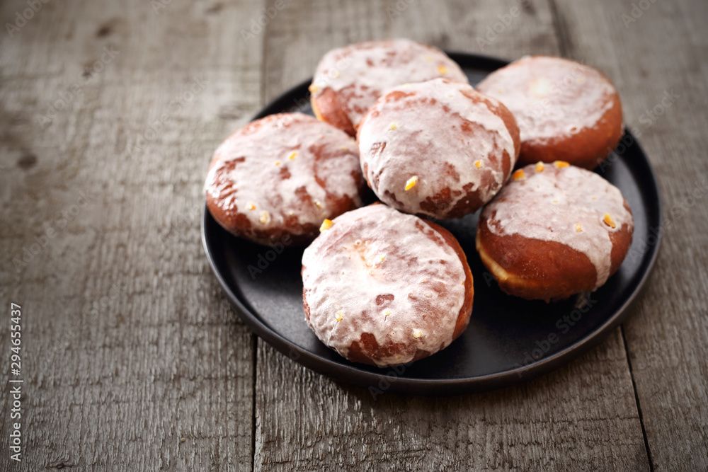 Traditional donuts with icing stuffed with marmalade. Traditional donuts with icing stuffed with marmalade.