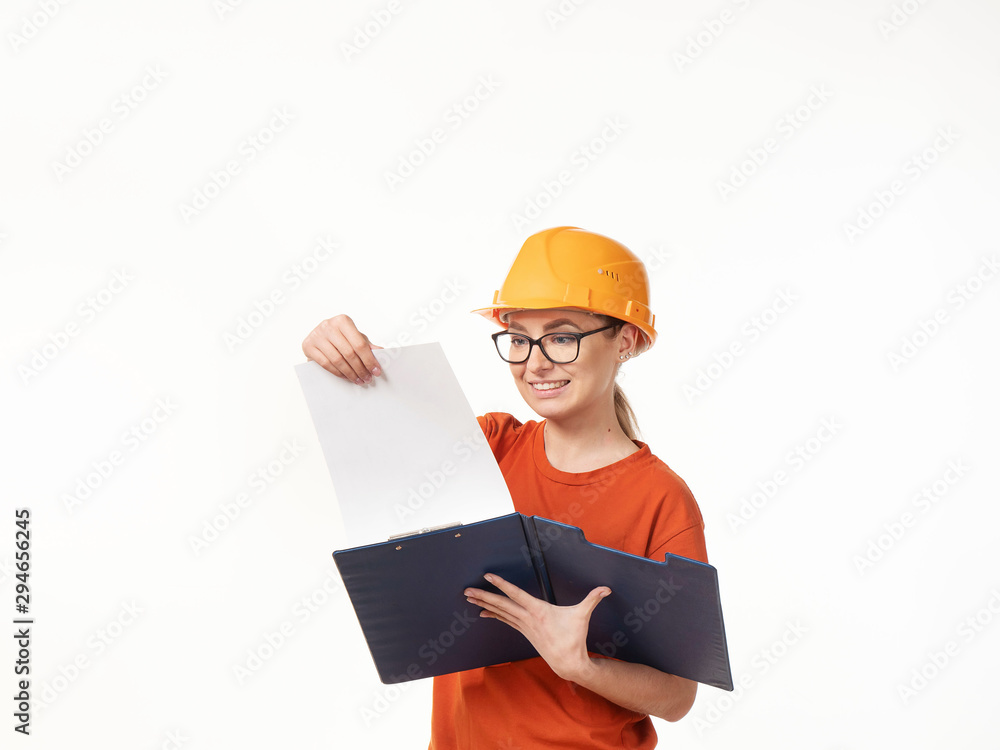 beautiful foreman girl in a yellow helmet with a blue folder on a white background beautiful foreman girl in a yellow helmet with a blue folder on a white background