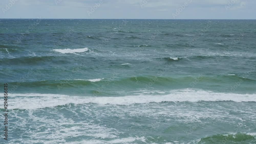 Sea surf on Curonian Spit. Big waves on Baltic sea. Kaliningrad Oblast, Russia. Sea surf on Curonian Spit. Big waves on Baltic sea. Kaliningrad Oblast, Russia.