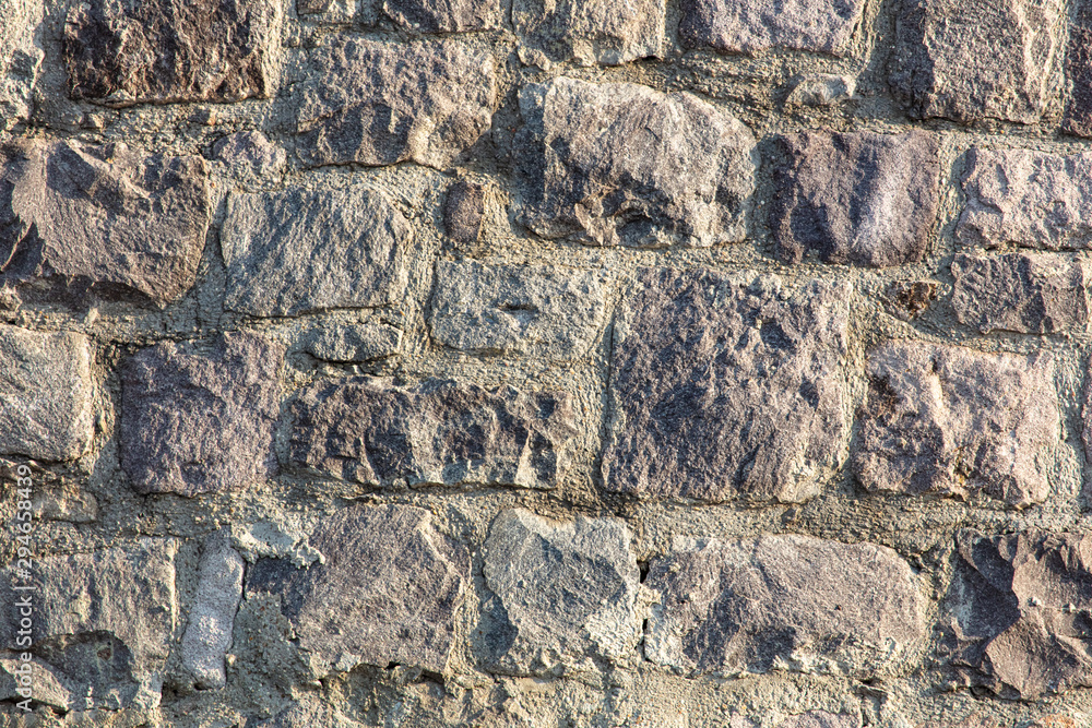Fototapeta premium Wall of stone blocks as an abstract background