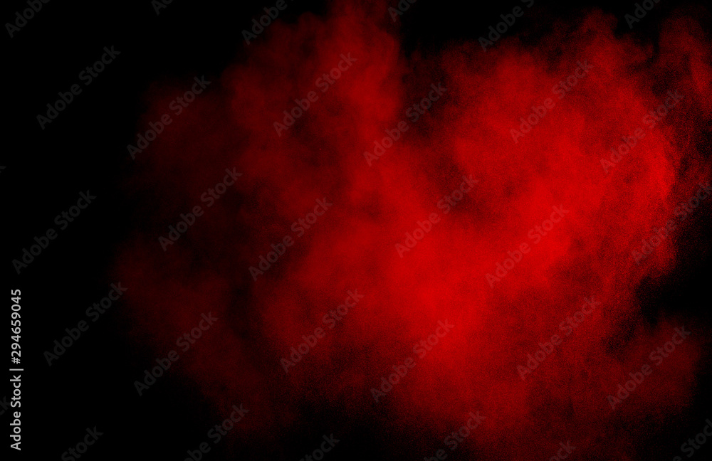 Red powder explosion cloud on black background. Freeze motion of red color dust particles splashing. Red powder explosion cloud on black background. Freeze motion of red color dust particles splashing.