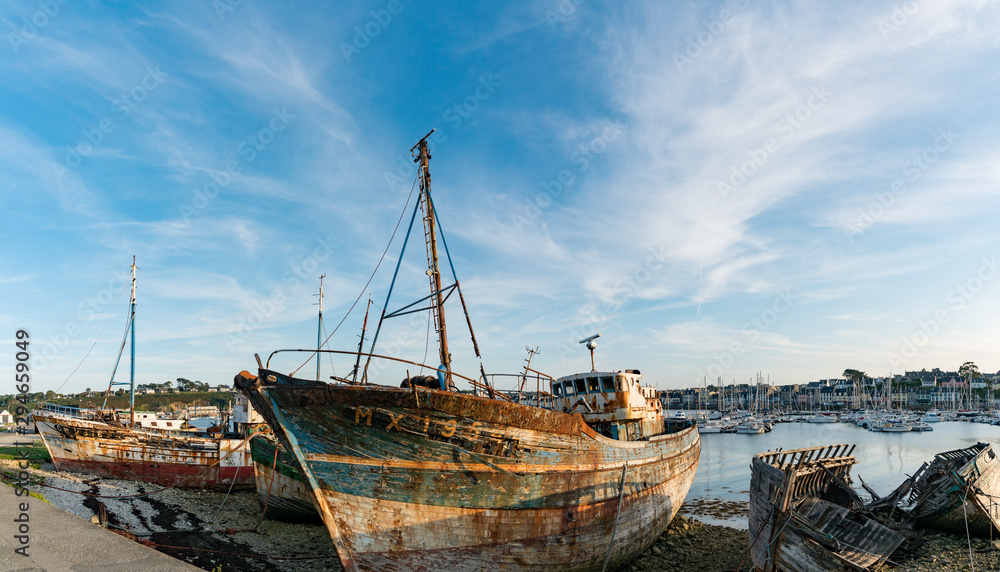old fishing boat wrecks in the ship cemetery of Camaret-Sur-Mer old fishing boat wrecks in the ship cemetery of Camaret-Sur-Mer