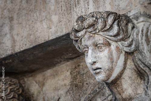 Ancient aged sculpture of beautiful Venetian Renaissance Era woman in Venice, Italy